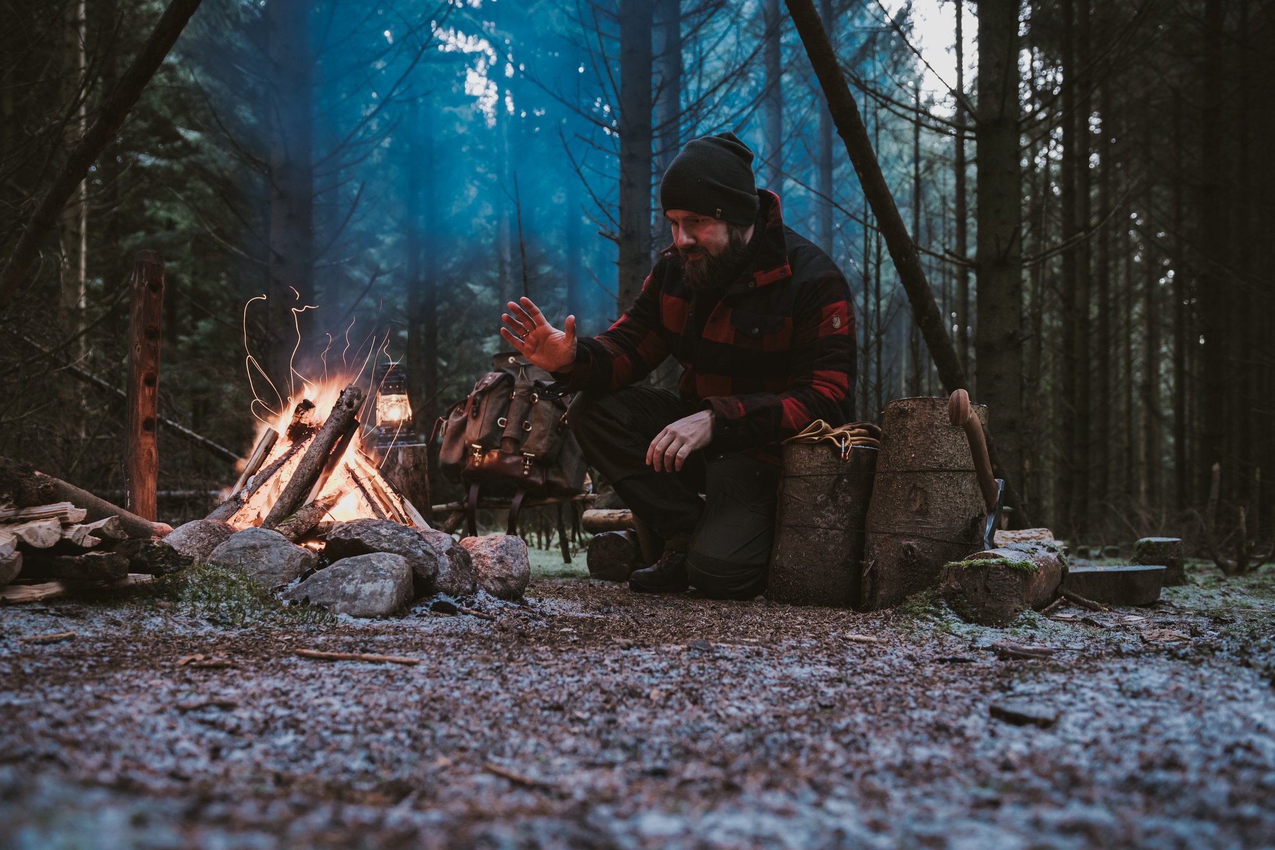 enjoying a fire built with a hand forged axe